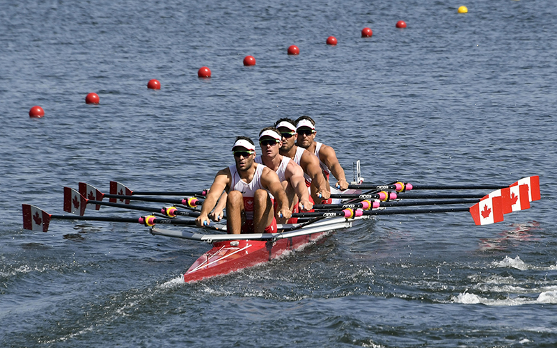Canada's Pascal Lussier, Canada's Will Dean, Canada's Robert Micael Gibson and Canada's Julien Bahain row during the Men's Quadruple Sculls rowing competition at the Lagoa stadium during the Rio 2016 Olympic Games in Rio de Janeiro on August 6, 2016.