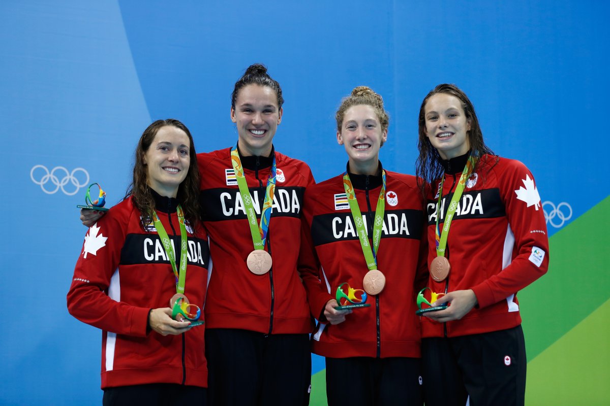 Bronze medalist Sandrine Mainville, Chantal Van Landeghem, Taylor Ruck and Penny Oleksak of Canada pose during the medal ceremony the Women's 4 x 100m Freestyle Relay on Day 1 of the Rio 2016 Olympic Games at the Olympic Aquatics Stadium on August 6, 2016 in Rio de Janeiro, Brazil.