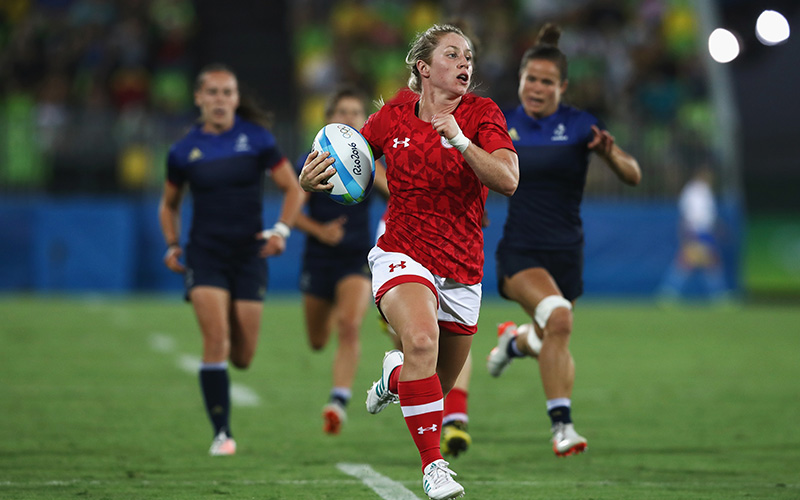 Kayla Moleschi of Canada carries the ball in to score a try against France during the Women's Quarter-final 2 rugby match on Day 2 of the Rio 2016 Olympic Games at Deodoro Stadium on August 7, 2016 in Rio de Janeiro, Brazil.  