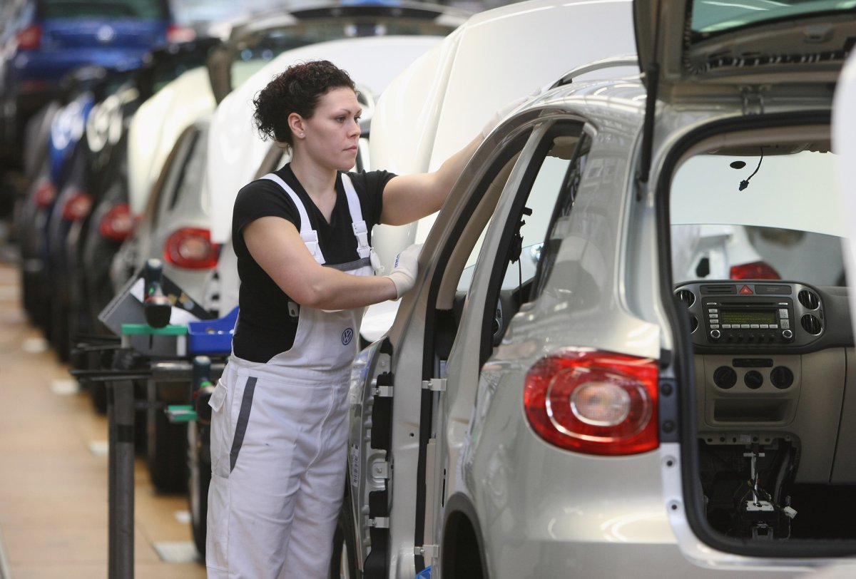 An automotive worker assembles cars at a Volkswagen factory in 2011 in Wolfsburg, Germany.