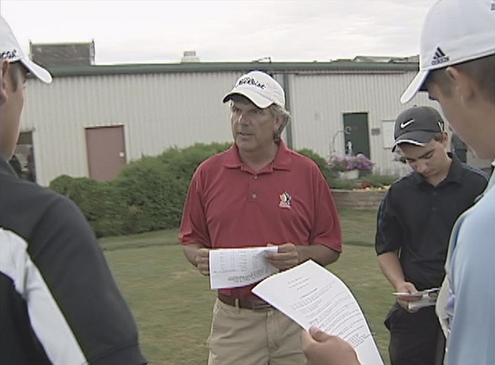 Garth Goodbrandson chats with members of the Manitoba Bisons golf team in 2011.