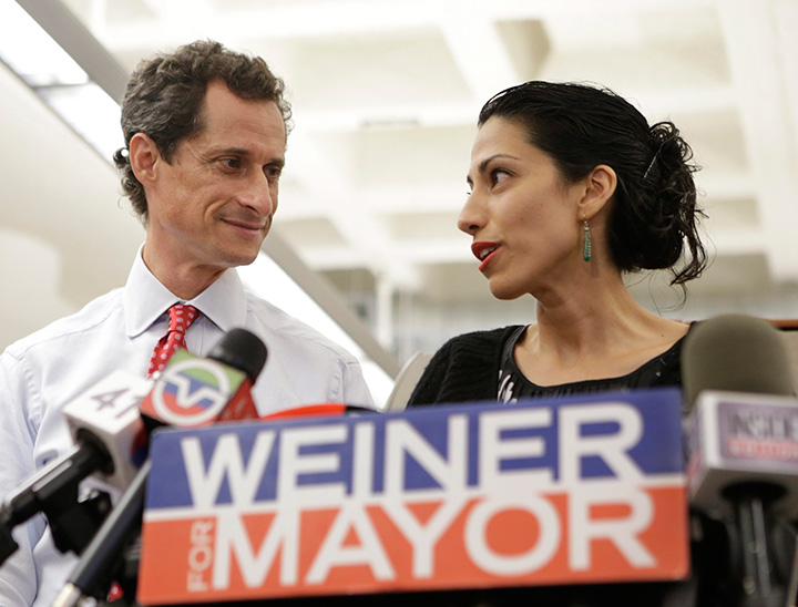 In this July 23, 2013 file photo, Huma Abedin, alongside her husband, then-New York mayoral candidate Anthony Weiner, speaks during a news conference in New York. 