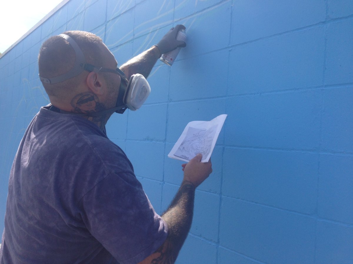 Cash Akoza is creating a series of murals to revitalize areas in Transcona. 