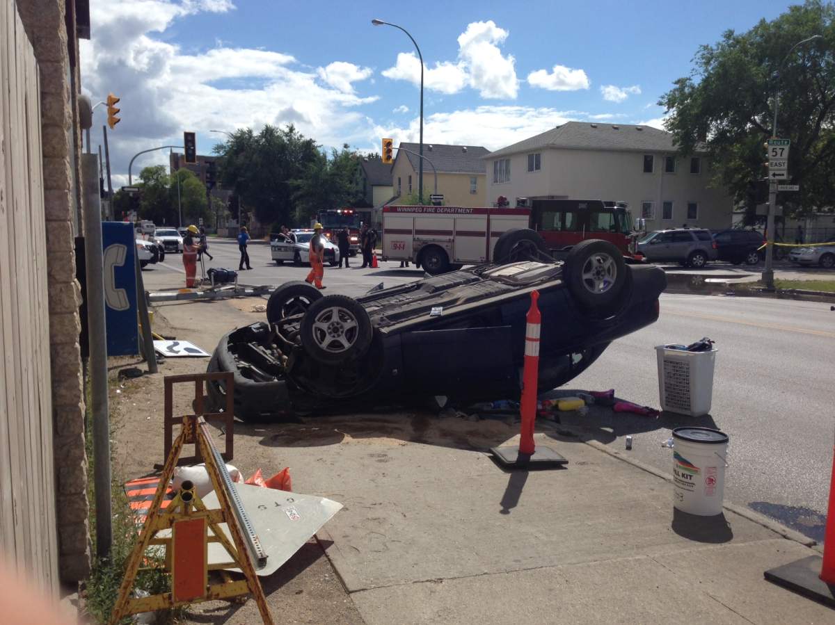 A car lies on its roof beside the Balmoral Hotel Friday afternoon. 