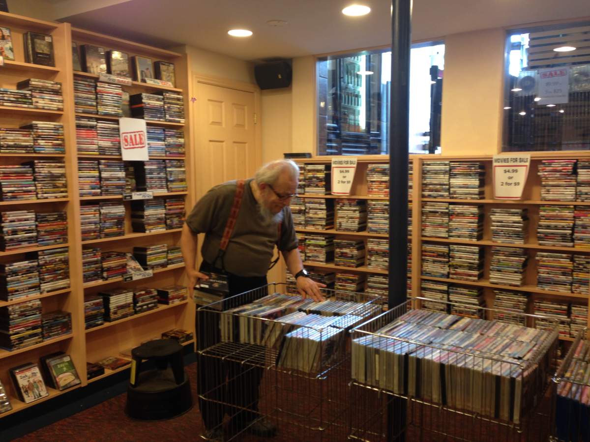 Video Difference customer Michael Karschdi browses through the store's many titles for sale. The movie rental store announced on Tuesday it plans to close its doors this month after 34 years in business.