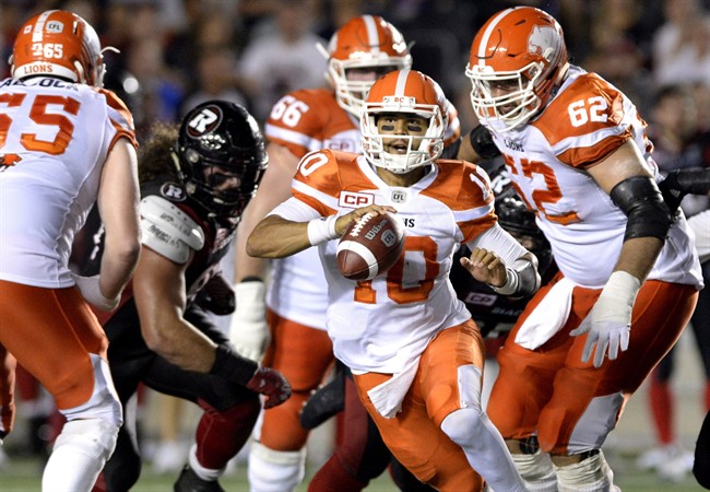 B.C. Lions’ Jonathon Jennings (10) runs the ball against the Ottawa Redblacks during second half CFL action on Thursday, Aug. 25, 2016 in Ottawa.