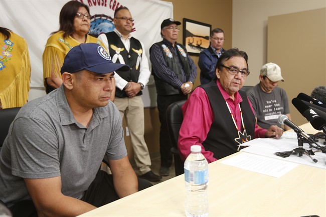 Manitoba’s former aboriginal affairs minister Eric Robinson, centre, with Norway House residents Leon Swanson, left, and David Tait Jr. announces at a press conference in Winnipeg on Friday, August 26, 2016 that the two men were switched at birth in 1975 when their mothers gave birth at Norway House Indian Hospital.