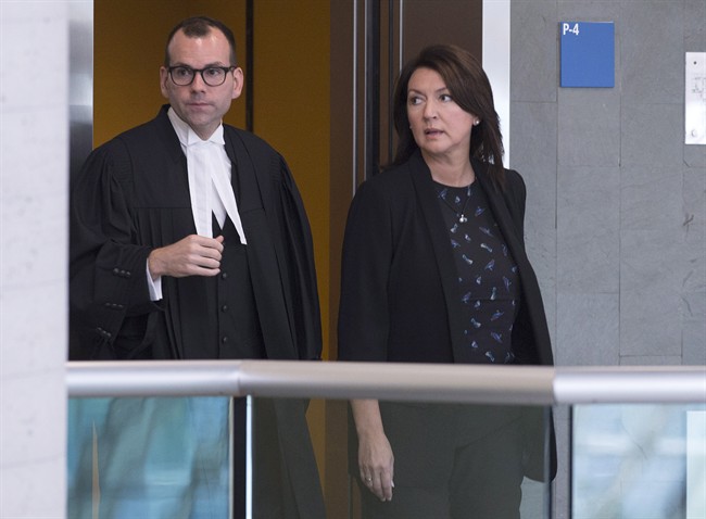 In this August 2016 file photo, former Quebec deputy premier Nathalie Normandeau, right, and her lawyer Maxime Roy arrive at the courthouse to face accusations of fraud and corruption.A judge ruled the trial will proceed despite lengthy delays. Monday, March 26, 2018.