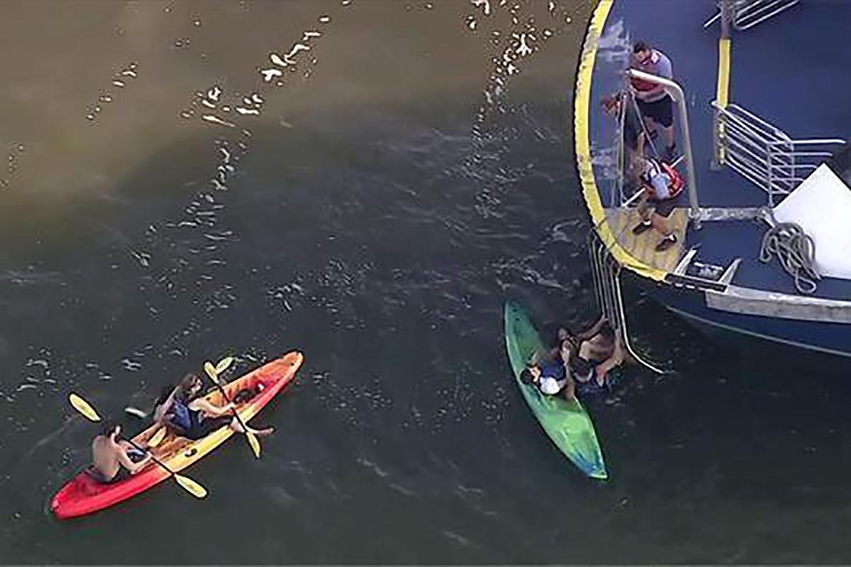 This image made from a video provided by WABC-TV shows kayakers being rescued on the Hudson River, Tuesday, Aug. 30, 2016, on the west side of Manhattan. 