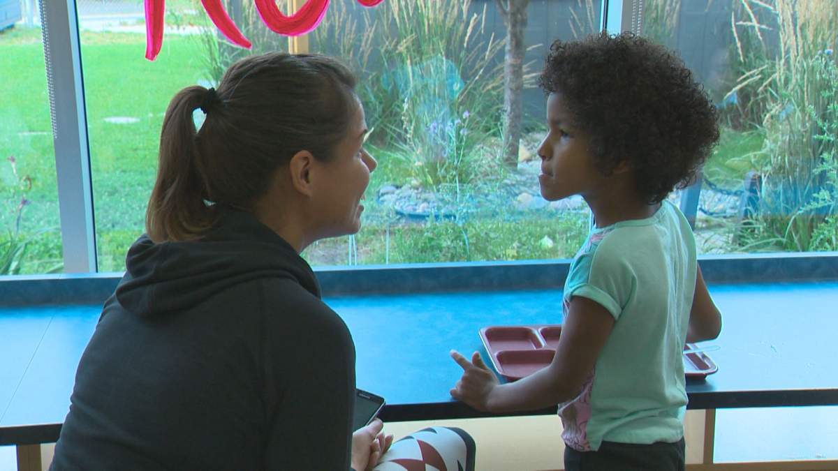 Erica Swan chats with her 5-year-old daughter Davinia at an Edmonton school breakfast program. August 29, 2016.