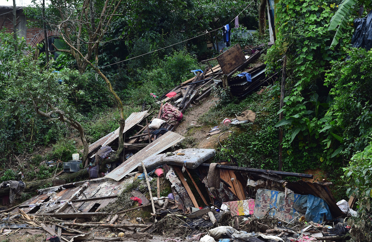 View of damage caused by a landslide ensuing the passage of Tropical Storm Earl in the community of Xaltepec, Puebla state, eastern Mexico on August 8, 2016. 