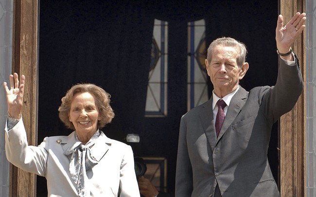 FILE - In this Thursday, June 5, 2008 file photo, former Romanian King Michael I, right, and his wife Anne, left, wave from the balcony of the Peles Castle, in Sinaia, Romania. Romania‚Äôs royal house says former King Michael, who has cancer, will miss his wife‚Äôs funeral on the advice of medics. The Royal House said Monday, Aug. 8, 2016, five doctors had recommended that Michael, 94, not travel to Romania to attend the Aug. 13 funeral of Anne of Romania, his wife of 68 years. (AP Photo/Paul Buciuta, File).