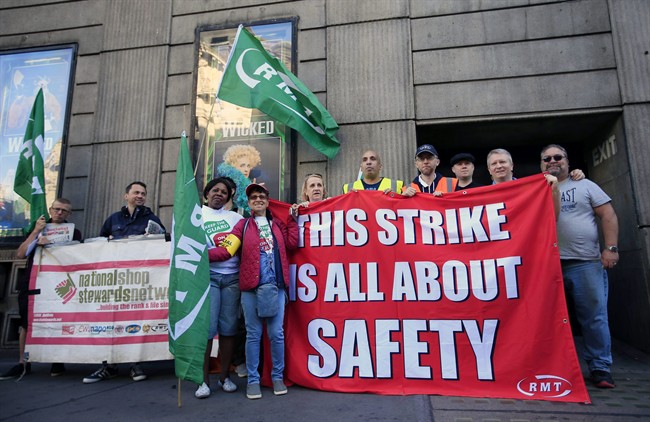 Rail workers form a picket line opposite Victoria Station during a strike in London, Monday, Aug. 8, 2016. Hundreds of thousands of London commuters face disruption during a five-day strike on one of Britain’s most problem-plagued rail lines. Southern Rail workers walked off the job Monday over plans to remove conductors from trains. Mick Cash, general-secretary of the Rail, Maritime and Transport Union, said the plan would mean that “jobs and safety are compromised on these dangerously overcrowded trains." But train operator Govia Thameslink said the strike was “completely unjustified.” It said it hoped to run 60 percent of scheduled services during the walkout. (Jonathan Brady/PA via AP).