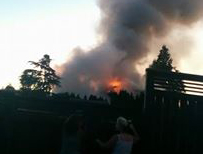 Maple Ridge resident Debbie Oliwa Steines took this photo of a neighbouring house that caught fire on Sunday, Aug. 14.