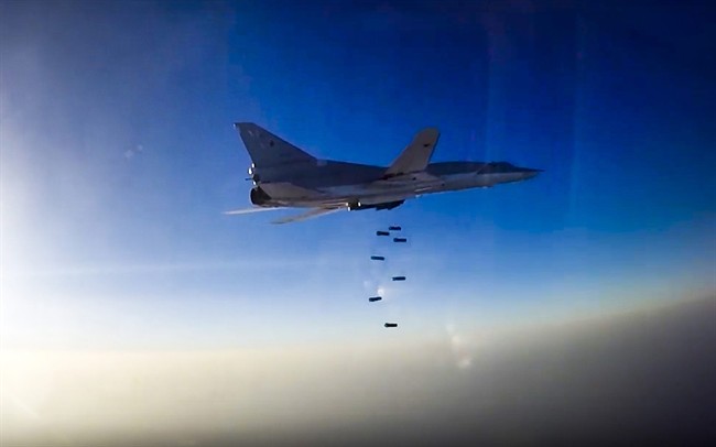 In this frame grab provided by Russian Defence Ministry press service, Russian long range bomber Tu-22M3 flies during an air strike over Aleppo region of Syria on Tuesday, Aug. 16, 2016. (Russian Defence Ministry Press Service photo via AP).