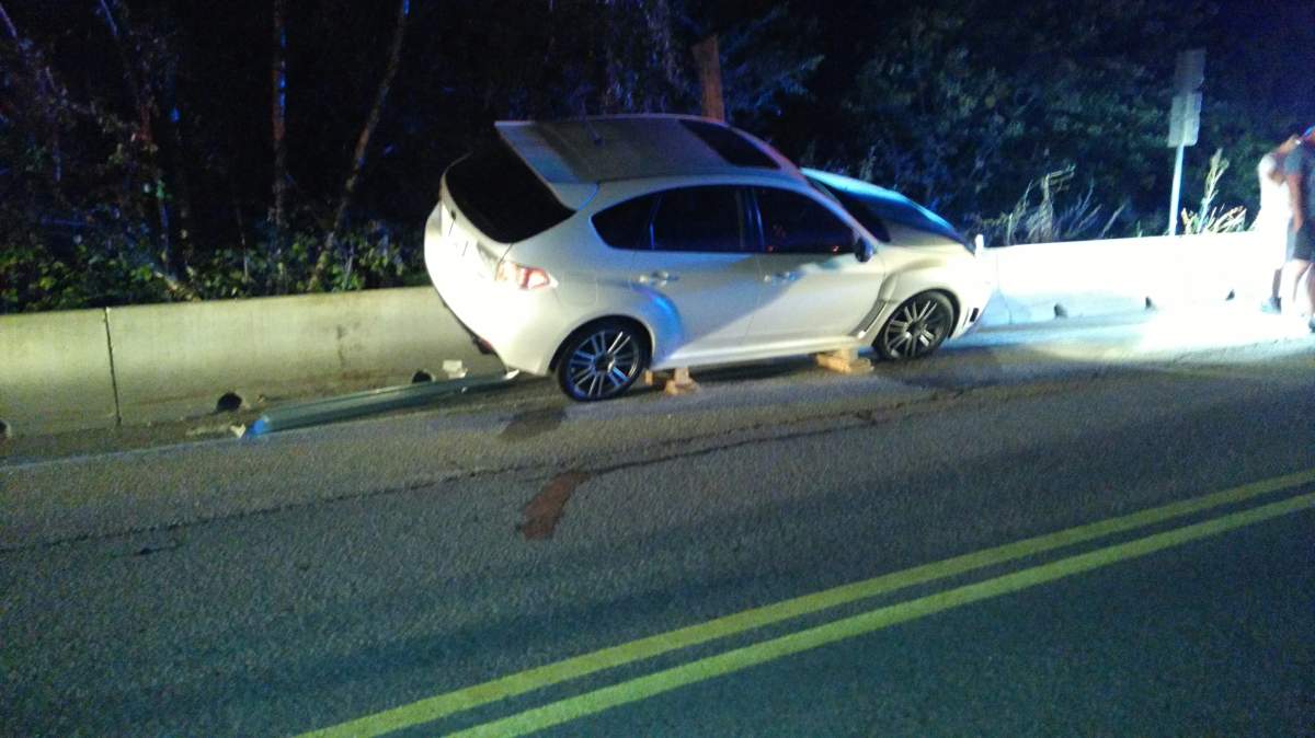 Car gets stuck on Naramata barrier - image