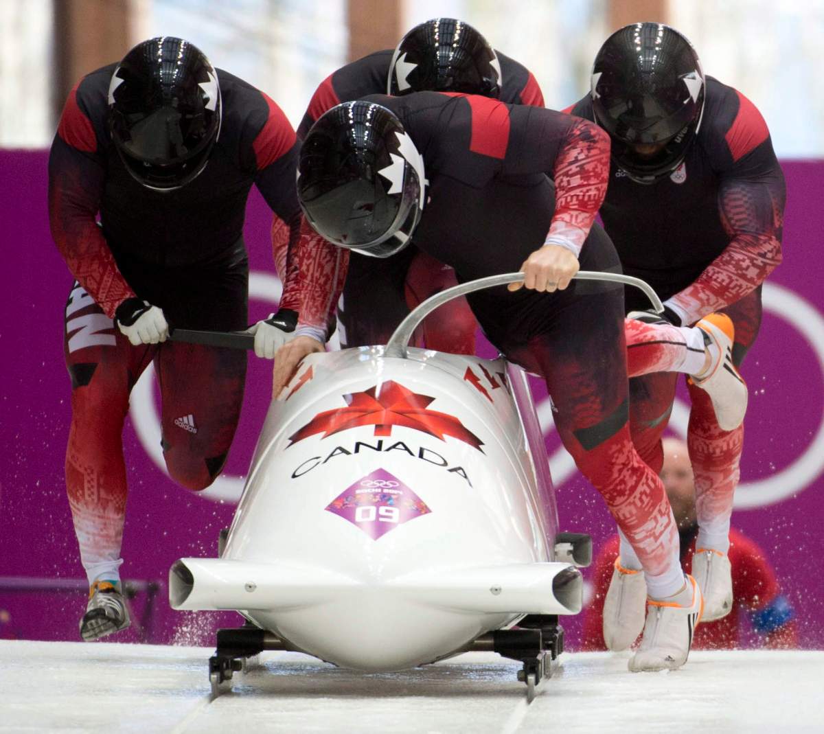 Canada’s Lyndon Rush, Lascelles Brown, David Bissett and Neville Wright are seen at the start of the 4th heat of the Men’s Four-Man Bobsled at the Sochi Winter Olympics in Krasnaya Polyana, Russia, Sunday, Feb. 23, 2014.