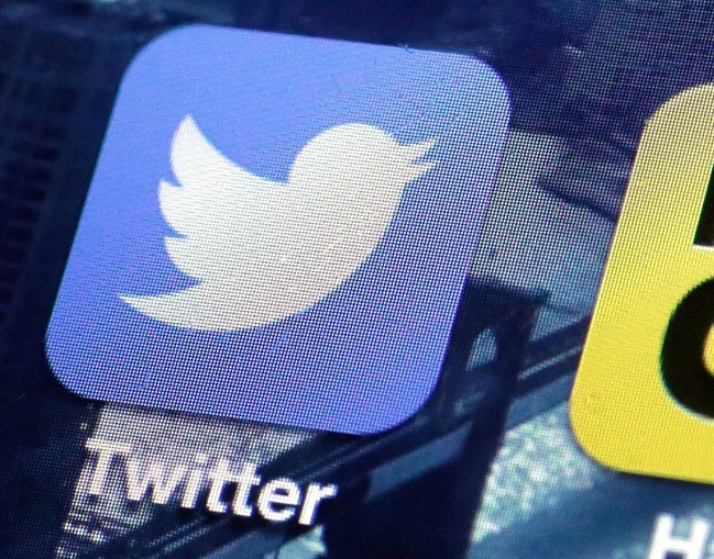 This Friday, Oct. 18, 2013, file photo, shows a Twitter app on an iPhone screen in New York. A federal judge in San Francisco on Wednesday, Aug. 10, 2016, dismissed a lawsuit accusing Twitter of supporting the Islamic State group. 