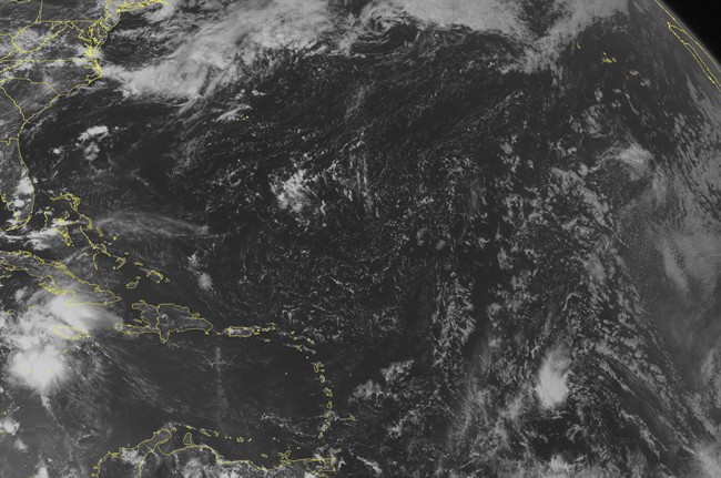 This NOAA satellite image taken Tuesday, Aug. 2, 2016 at 12:45 PM EDT shows Tropical Storm Earl 210 miles south of Grand Cayman with maximum winds of 50 miles per hour. Earl is moving west at 22 miles per hour towards the Yucatan Peninsula. To the east, high pressure brings mostly sunny skies to the eastern Caribbean Sea. (Weather Underground via AP).