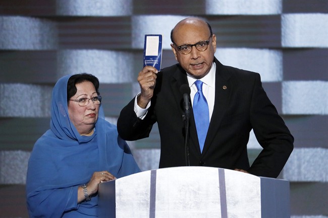 Khizr Khan, father of fallen US Army Capt. Humayun S. M. Khan holds up a copy of the Constitution of the United States as his wife listens during the final day of the Democratic National Convention in Philadelphia in this July 28, 2016 file photo.