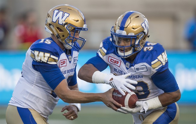 Winnipeg Blue Bombers quarterback Matt Nichols hands off to running back Andrew Harris during Friday's game against the Montreal Alouettes.