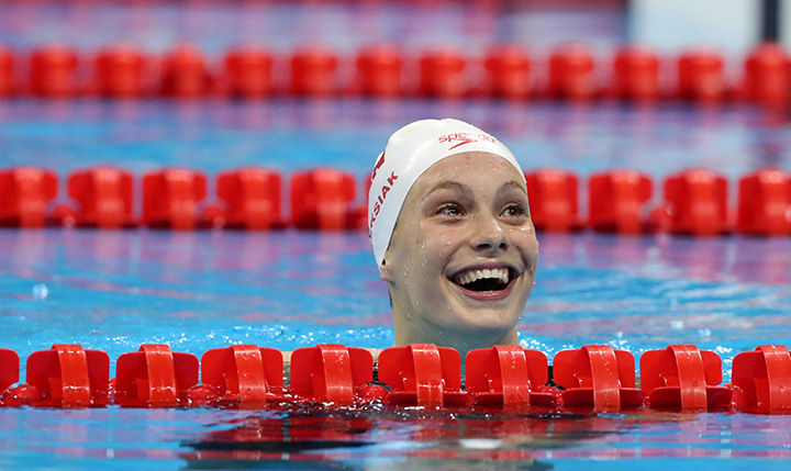 Canada’s Penny Oleksiak smiles after winning the gold medal and setting a new Olympic record in the women’s 100-metre freestyle during the swimming competitions at the 2016 Summer Olympics, Thursday, Aug. 11, 2016, in Rio de Janeiro, Brazil.