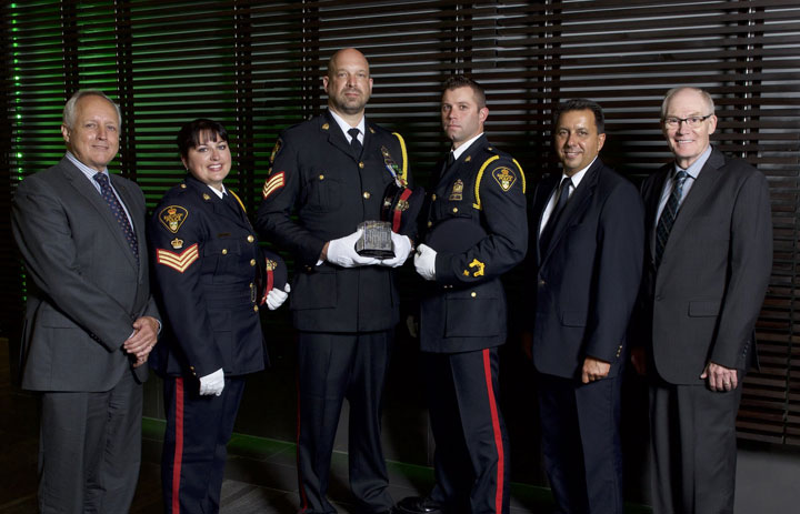 Three members of the Saskatoon Police Service were honoured Tuesday for their work on economic crime.