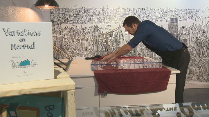 Sandy Muldrew, owner and only employee of The Prints and the Paper, works in his Edmonton shop.