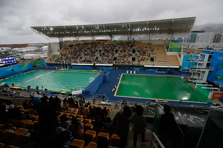 The water of the diving pool at right appears a murky green as the water polo pool at left appears a greener colour than the previous day during a preliminary round match between United States and France in the Maria Lenk Aquatic Center at the 2016 Summer Olympics in Rio de Janeiro, Brazil, Wednesday, Aug. 10, 2016.
