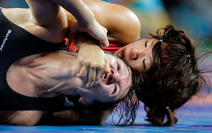 Latvia’s Anastasija Grigorjeva, left, and Japan’s Risako Kawai compete during the women’s wrestling freestyle 63-kg competition at the 2016 Summer Olympics in Rio de Janeiro, Brazil, Thursday, Aug. 18, 2016.