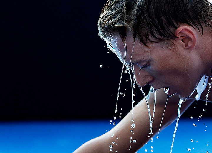 Russia’s Igor Polyanskiy is doused with water after crossing the finish line in the men’s triathlon event at the 2016 Summer Olympics in Rio de Janeiro, Brazil, Thursday, Aug. 18, 2016.
