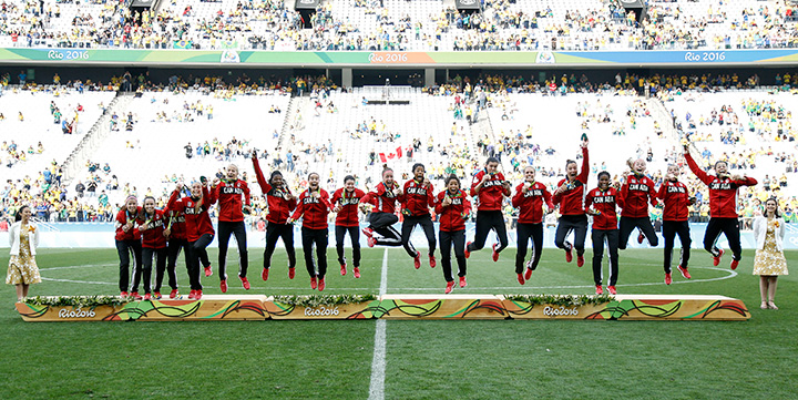 Team Canada celebrates on the podium after winning women's soccer bronze after defeating Brazil, at the Arena Corinthians Stadium in Sao Paulo, Brazil on August 19, 2016. 