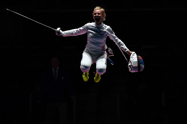 Russia's Violetta Kolobova celebrates after winning the women’s team epee bronze medal bout between Estonia and Russia as part of the fencing event of the Rio 2016 Olympic Games, on August 11, 2016, at the Carioca Arena 3, in Rio de Janeiro.  