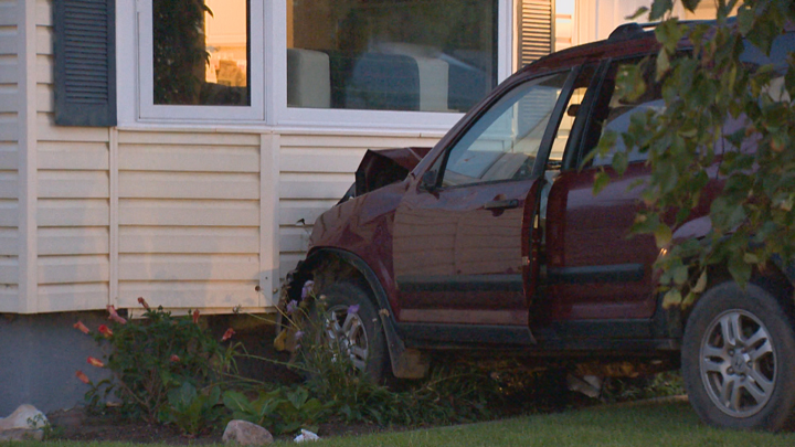 Girl sent to Saskatoon hospital after SUV hits parked car, crashes into house at Dufferin Avenue and Ruth Street.