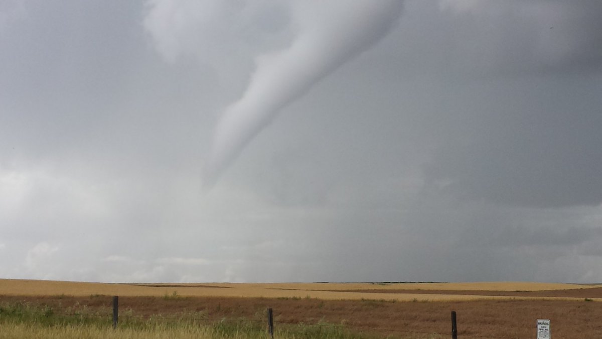 David McKinstry posted this photo of a funnel cloud nearly touching the ground near Hilda, Alta. Wednesday afternoon. Environment Canada has confirmed that a landspout tornado did touch down near Schuler, Alta., a short distance away.
