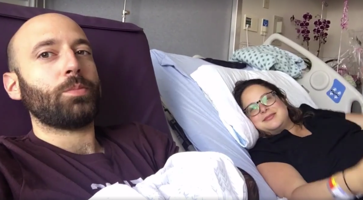 A still of Philip Balabanos, his wife Anna Theodorou and their daughter Lea in hospital.