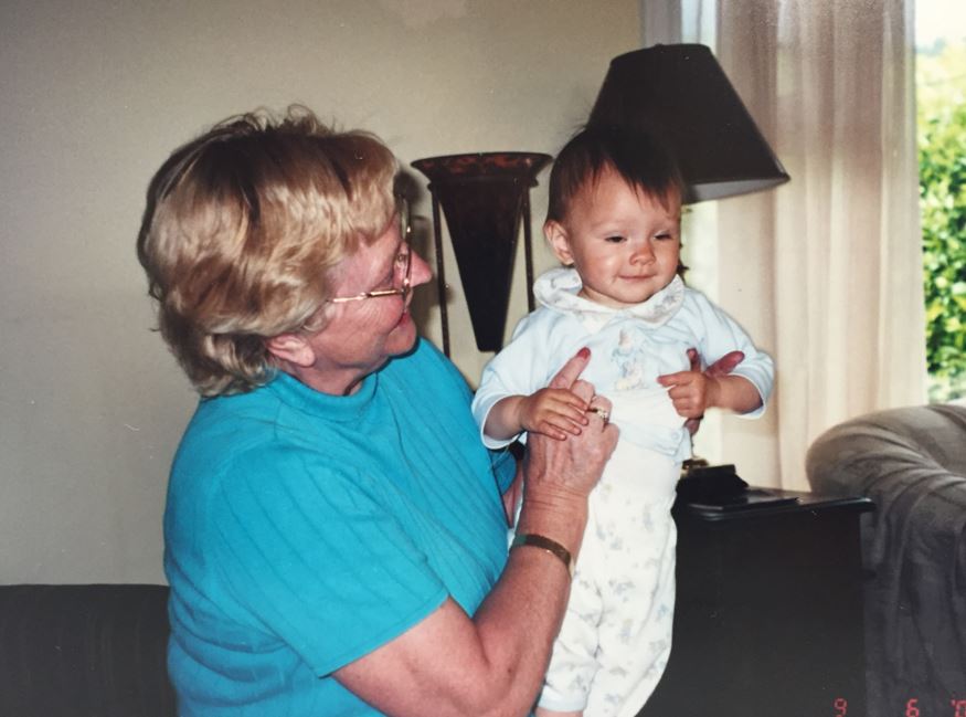 Shallon Olsen, who started gymnastics at the age of 3, gets a lift from her grandmother.