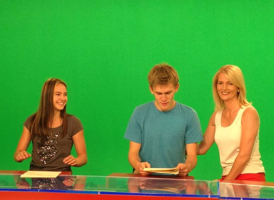Linda Olsen, her niece Olympic gymnast Shallon Olsen, and her son Parker on the Global Calgary news set.