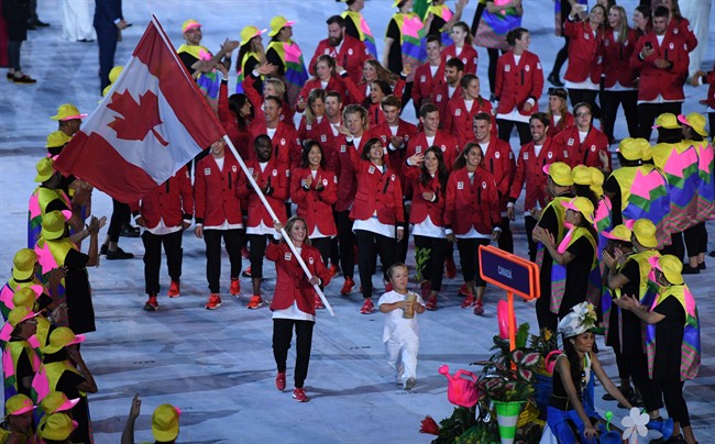 Rosie MacLennan leads team Canada into the stadium during the opening ceremonies at the 2016 Olympic Games in Rio de Janeiro, Brazil on Friday, Aug. 5, 2016.