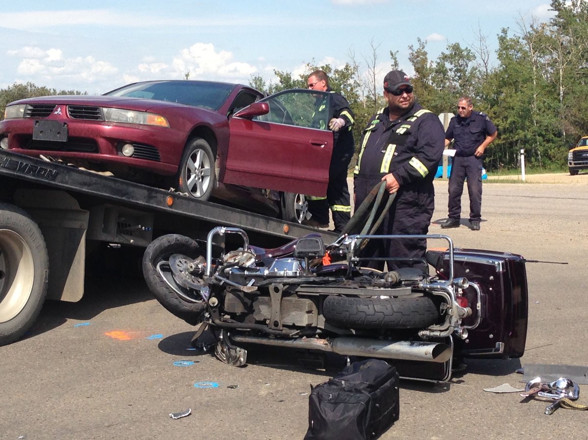 Crews cleanup after a scene in Strathcona County after a serious collision involving a car and motorcycle, Monday, Aug. 8, 2016. 