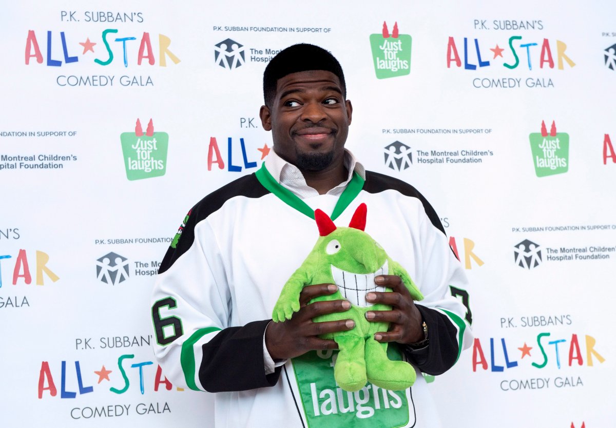 Nashville Predators defenceman P.K. Subban hams it up with a stuffed mascot during a news conference in advance of the P.K. Subban All-Star Comedy Gala, Monday, August 1, 2016 in Montreal.
