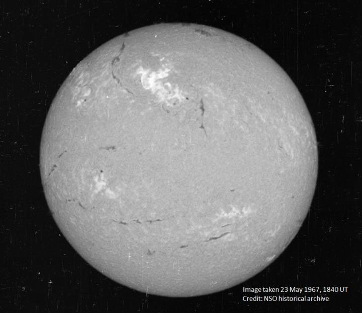A view of the sun on May 23, 1967, in a narrow visible wavelength of light called hydrogen-alpha. The bright region in the top centre region is the area where the large flare occurred.