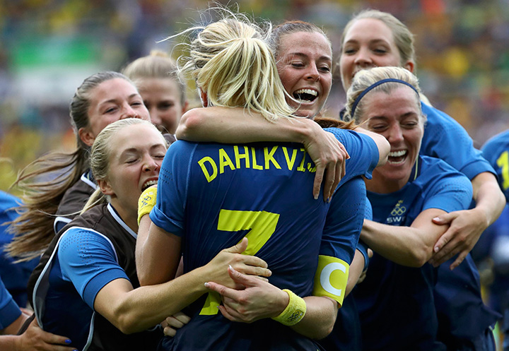 Lisa Dahlkvist of Sweden celebrates with teammates after scoring the winning goal during the penalty shootout against Brazil on August 16, 2016 in Rio de Janeiro, Brazil. 