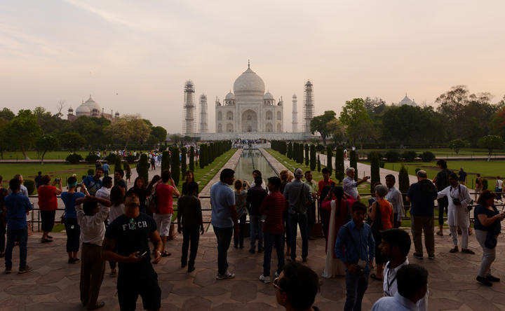 Tourists gather at the enterance of the Taj Mahal monument in Agra on April 16, 2016. 