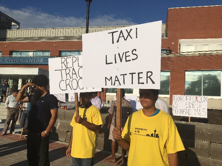 Taxi drivers hold a demonstration outside the East York Civic Centre on Aug. 17, 2016.