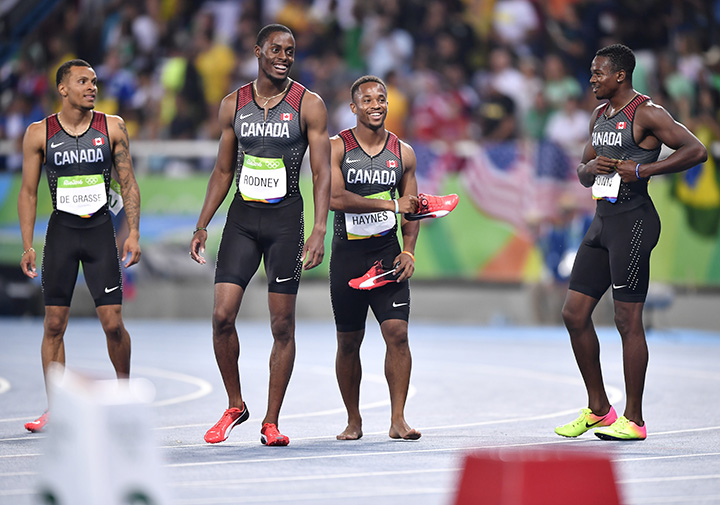 Team Canada Canada's Andre De Grasse, Brendon Rodney, Akeem Haynes and  Aaron Brown celebrate after finishing third of the Men's 4x100m Relay Final during the athletics event at the Rio 2016 Olympic Games at the Olympic Stadium in Rio de Janeiro on August 19, 2016.  