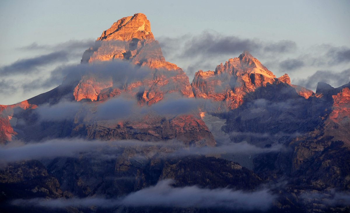 The morning Sun hits the tips of the Grand Tetons October 5, 2012 in the Grand Teton National Park in Wyoming.