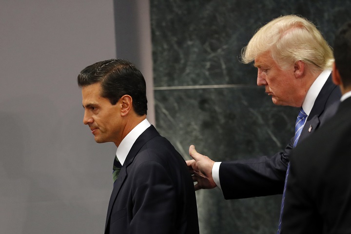 Donald Trump walks with Mexico President Enrique Pena Nieto at Los Pinos, the presidential official residence, in Mexico City, Wednesday, Aug. 31, 2016.