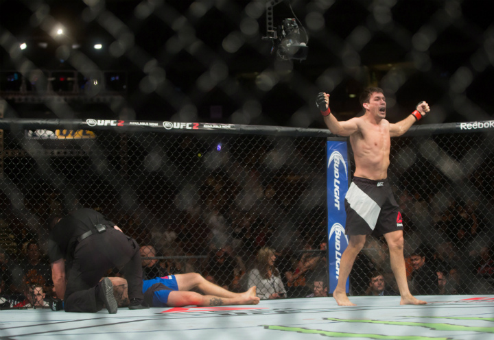 Demian Maia, right, of Brazil, celebrates after defeating Carlos Condit, of Albuquerque, N.M., during a welterweight bout during a UFC Fight Night event in Vancouver on Saturday, August 27, 2016.