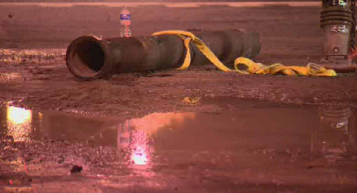 Crews are working hard on repairing a sinkhole that caused a water main to burst in Coquitlam.